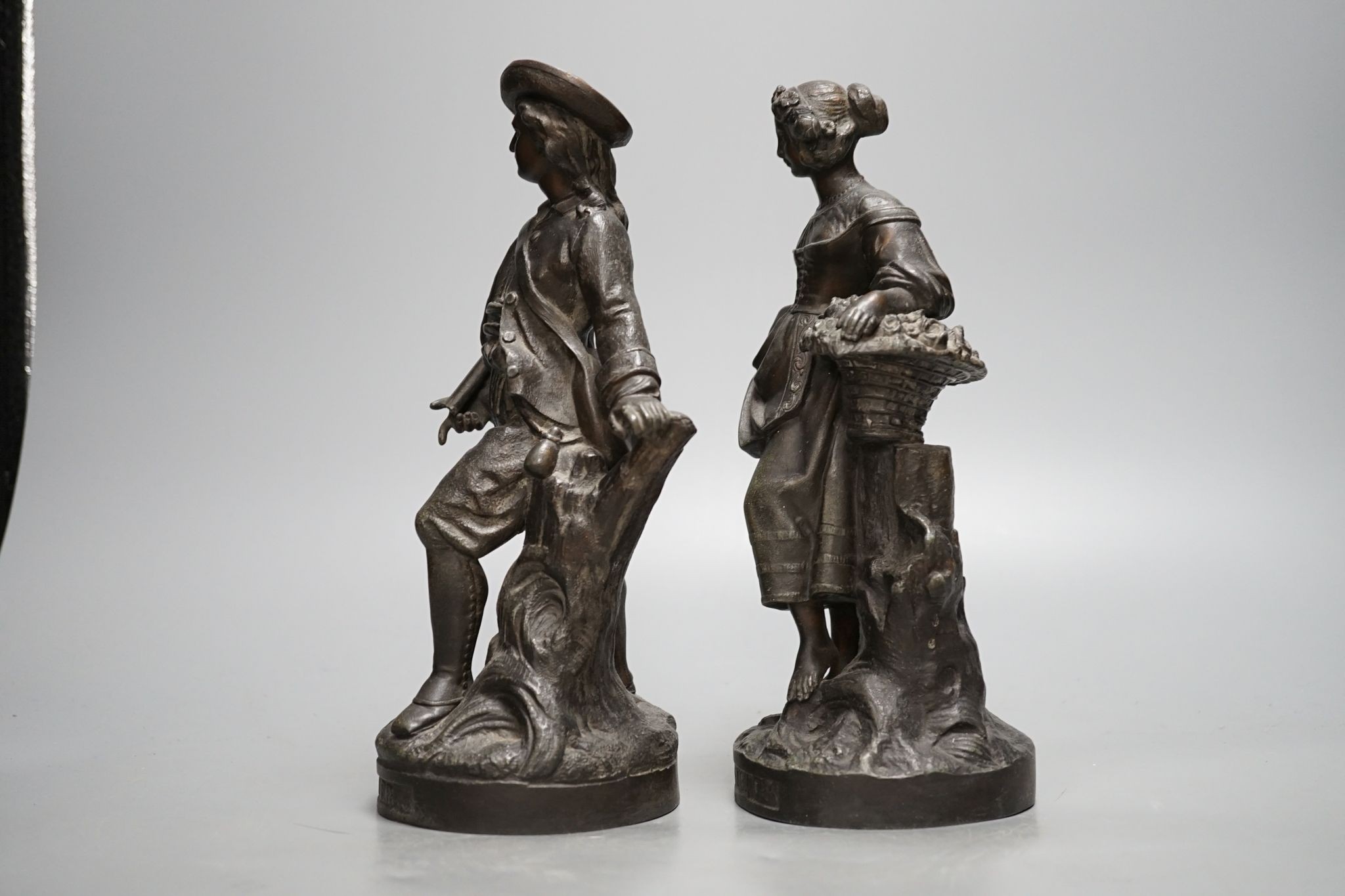 A pair of French cast metal figures, Hiver and Printemps, 25.5cm